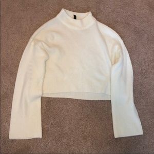 White mock turtleneck with bell sleeves